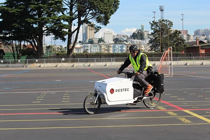 Pestec employee on Bicycle