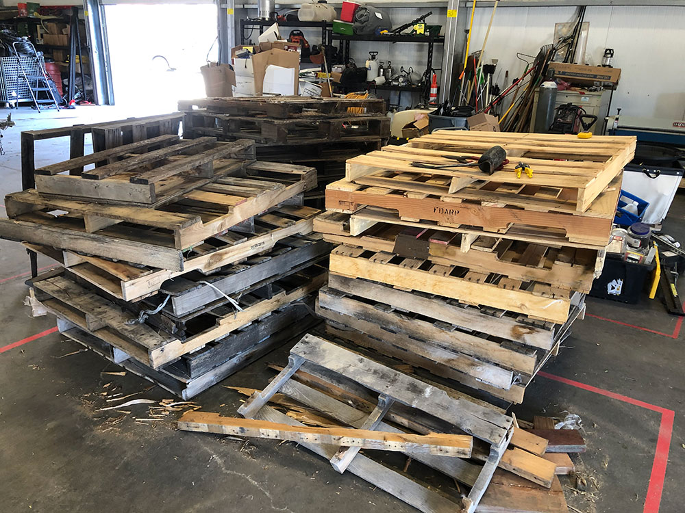 Wooden pallets that will be used to building the planter boxes